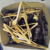 A box containing assorted wooden shoe trees and wooden coat hangers