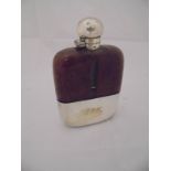 An early 20th Century hip flask with crocodile skin and plated mounts,