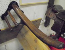 A Musgrave wall-mounted iron and mahogany side saddle rack CONDITION REPORTS Approx