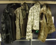 Three faux fur coats, together with a box containing assorted fur hats, stoles,