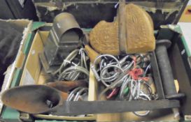 A box containing assorted bits, wooden stirrups, metal stirrups,