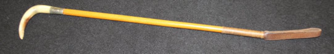 A child's riding crop with horn handle, plated ferrule stamped "Swaine",