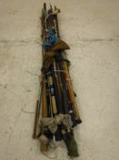 A large collection of assorted fishing rods by various makers, a rod holdall,