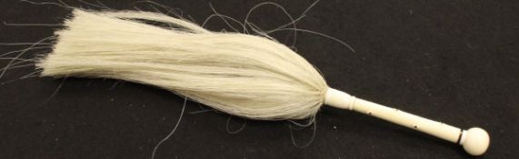 An early 20th Century ivory-handled fly whisk CONDITION REPORTS Handle measures