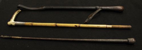 A gentleman's riding crop with antler handle and "Swaine & Adeney" button, silver ferrule,