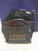 A fisherman's Daiwa holdall containing a large number of landing nets, keepnets and other luggage,