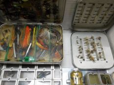 A collection of five alloy fly boxes containing a selection of trout flies,