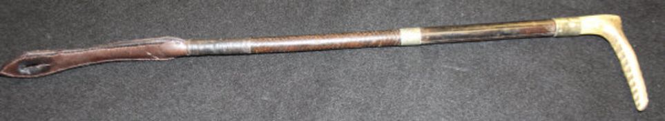 A ladies riding crop with antler handle and "Swaine & Adeney" button,