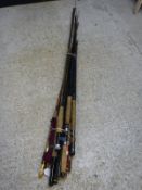 Several fly fishing rods and a spinning rod by various makers