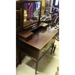 An early 20th Century mahogany and satinwood banded dressing table with assorted drawers and