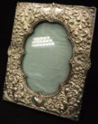 A late Victorian silver photo frame with embossed acanthus and sea scroll decoration (Birmingham