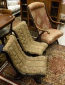 A pair of ebonised framed and buttoned upholstered salon chairs of scroll form on castors and a