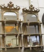 A pair of 19th Century wall mirrors with three serpentine fronted shelves CONDITION
