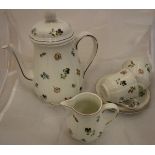 A Villeroy & Boch floral decorated duet coffee service comprising coffee pot, cream jug and two cups