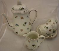 A Villeroy & Boch floral decorated duet coffee service comprising coffee pot, cream jug and two cups