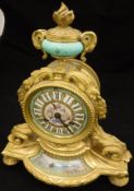 A 19th Century French gilt brass and porcelain cased mantle clock,