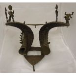 An early 20th Century Indian goat horn desk stand decorated with deities