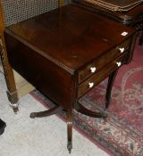 A Victorian mahogany work table, the plain top with drop leaves above two drawers each with turned