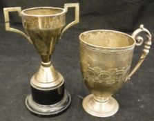 A Victorian silver cup with all over engine turned decoration and open cartouche with scrolling