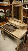 A pine dressing table with mirrored superstructure over a single drawer, raised on turned legs to