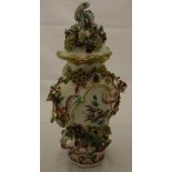 An 18th Century Chelsea or Derby frill vase and cover with floral encrusted and pierced decoration,