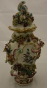 An 18th Century Chelsea or Derby frill vase and cover with floral encrusted and pierced decoration,