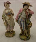A pair of late 19th Century Vion & Baury polychrome decorated bisque figures of a lady and