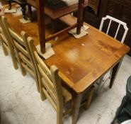 A modern cherry wood farmhouse style kitchen table in the French taste, together with a set of three