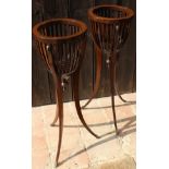 A pair of 19th Century mahogany jardinier stands