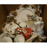 A box containing a Royal Albert "Old Country Roses" six place tea service, a Royal Doulton