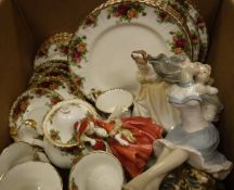 A box containing a Royal Albert "Old Country Roses" six place tea service, a Royal Doulton