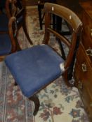 A set of six Victorian mahogany bar back dining chairs raised on sabre legs, together with a pair of