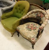 An early Victorian salon chair in olive green upholstery with shaped and buttoned back above a