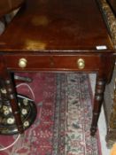 A Victorian mahogany pembroke table, the plain top with inlaid decoration above a single drawer with