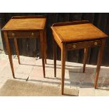 A pair of walnut and banded single drawer side tables on square section tapering supports
