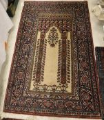 A Persian rug, the central panel set with Mirab style design with floral decorated columns, within a