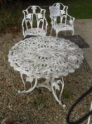 A modern painted metal garden table and two chairs, together with a modern composite garden seat