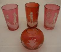 A collection of various glassware to include three Mary Gregory style cranberry glass beakers,