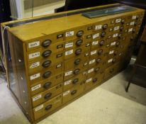 A haberdasher's display cabinet and a mahogany haberdasher's display cabinet with drawers and