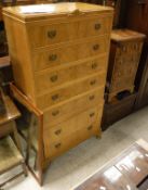 A mid 20th Century walnut chest of seven long drawers on cabriole legs to pad feet and a modern