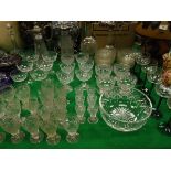 Four various claret jugs with plated mounts, a collection of 32 Tudor crystal glasses, six champagne