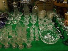 Four various claret jugs with plated mounts, a collection of 32 Tudor crystal glasses, six champagne