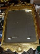 A 20th Century gilt framed wall mirror with moulded decoration and one further mirror