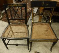 A Regency ebonised and gilt decorated cane seated bar back dining chair and another cane seated