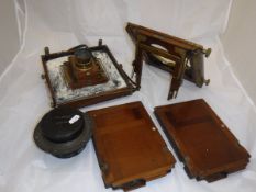 A box containing a mahogany and brass bound Bellows plate camera with Dallmyer lens,
