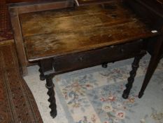 A 17th Century oak single drawer side table on barley twist supports (with alterations)