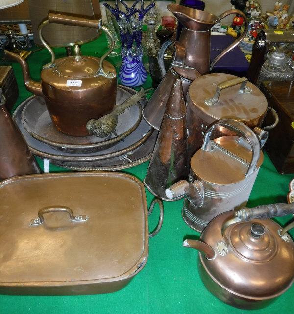 A quantity of various copper ware to include two kettles, watering can, two tapered jugs, ale