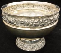 A late Victorian silver rose bowl of circular form with embossed shell and floral decoration (