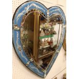 A Venetian style wall mirror in the form of a stylised love heart with blue etched border