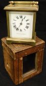 A circa 1900 French lacquered brass cased carriage clock, the enamelled dial with Roman numerals and